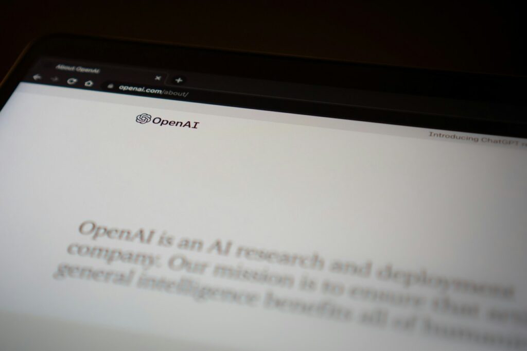 AI assistant helping write an email on a computer
